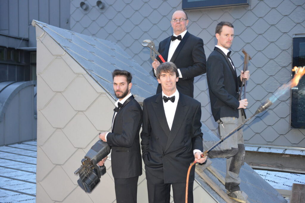 Team van Cu Zn, gespecialiseerd in zinkwerk voor daken en gevels